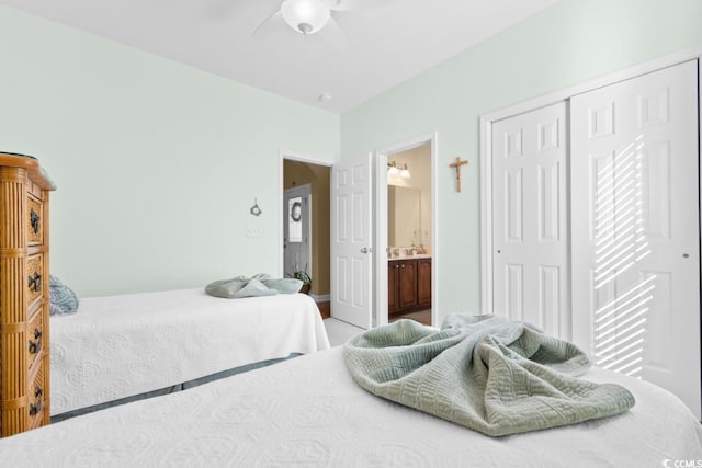 bedroom featuring a closet, connected bathroom, and a ceiling fan