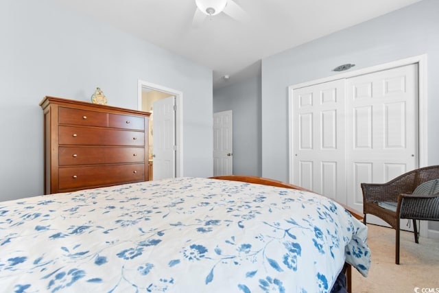 bedroom with light colored carpet, a closet, and ceiling fan