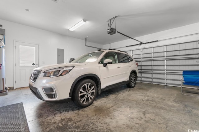 garage with electric panel, water heater, and a garage door opener