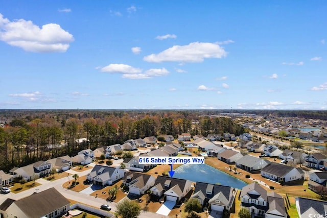 birds eye view of property with a residential view