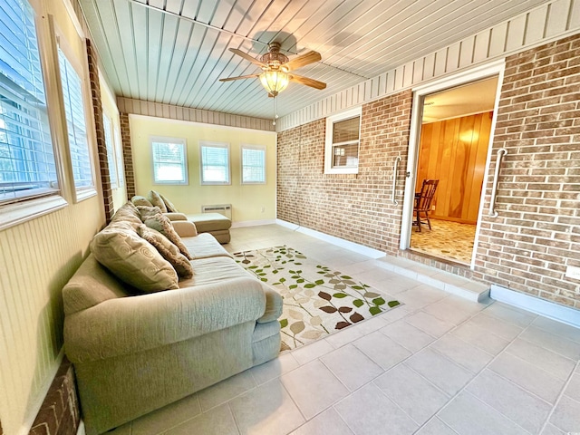 interior space featuring wooden ceiling and a ceiling fan