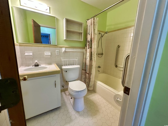 bathroom with tile patterned floors, toilet, tile walls, and vanity