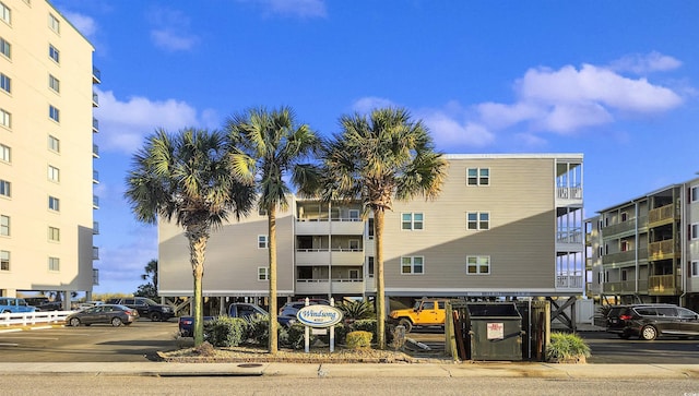 view of property featuring uncovered parking