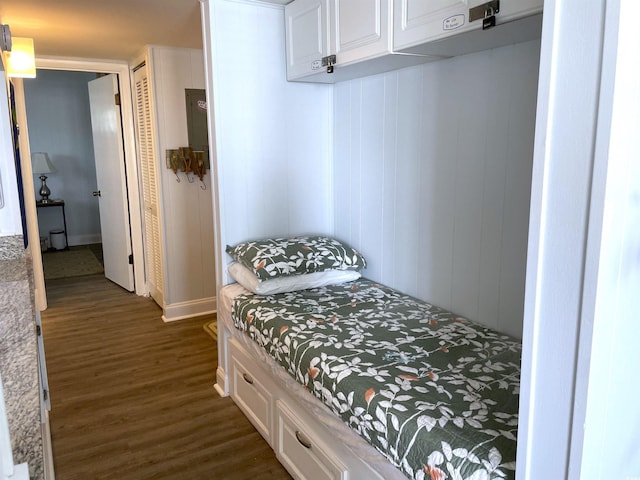 bedroom with dark wood-style floors