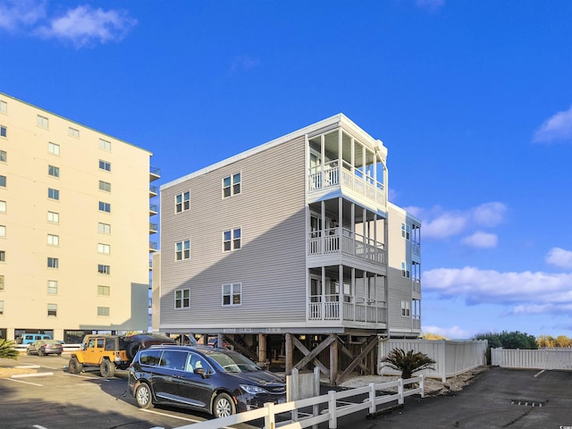 view of building exterior with fence