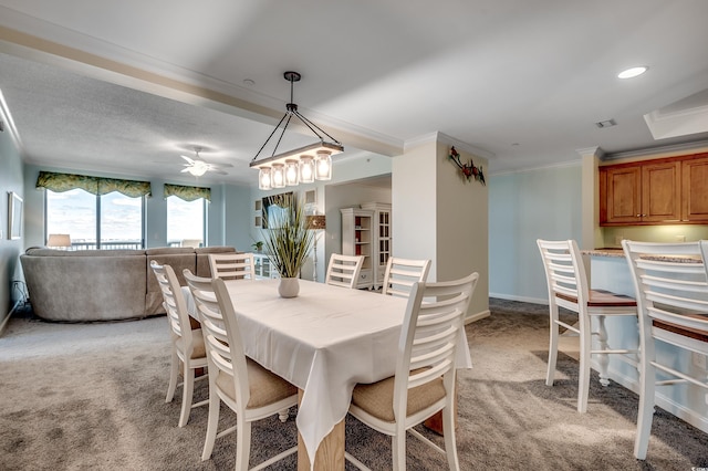 8500 Margate Cir Unit 2808, Myrtle Beach, SC 29572 - dining room with light carpet, ornamental molding, recessed lighting, and ceiling fan