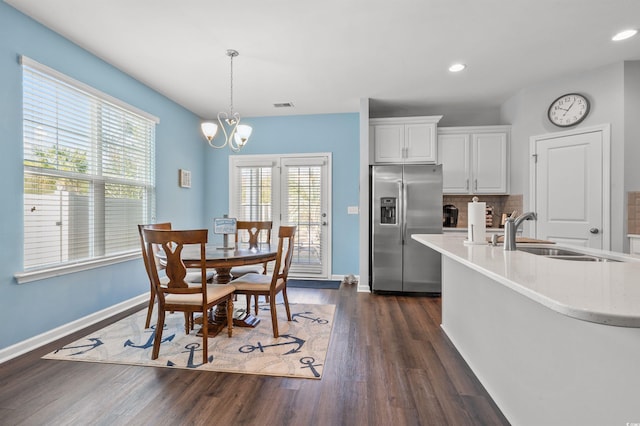 dining room featuring visible vents, recessed lighting, baseboards, a chandelier, and dark wood-style flooring