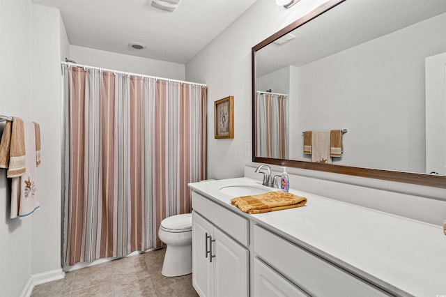 bathroom with tile patterned floors, toilet, and vanity