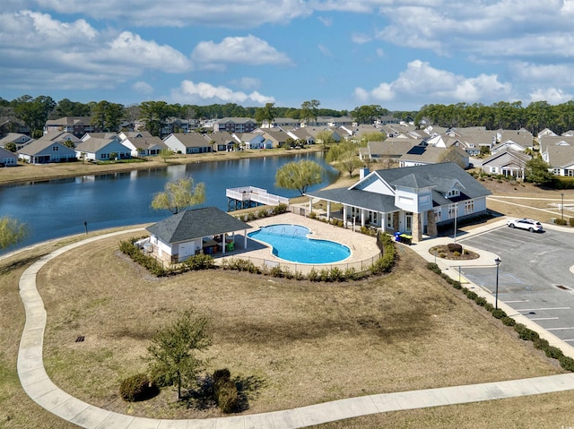 aerial view featuring a residential view and a water view