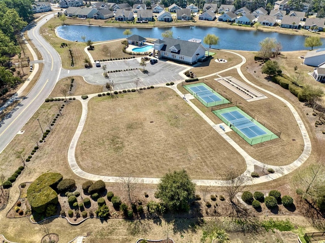 drone / aerial view featuring a residential view and a water view