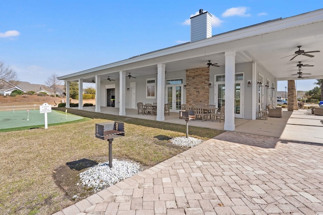 view of patio / terrace featuring french doors and a ceiling fan