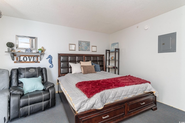 bedroom with electric panel, carpet floors, and a textured ceiling