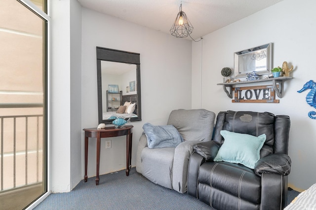 living area featuring carpet flooring and a healthy amount of sunlight