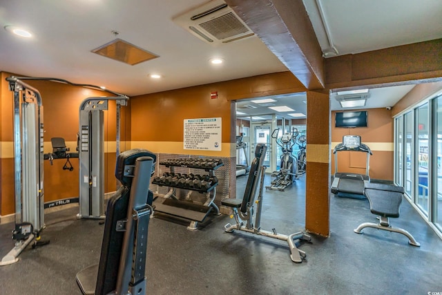 workout area with a wealth of natural light, visible vents, and recessed lighting