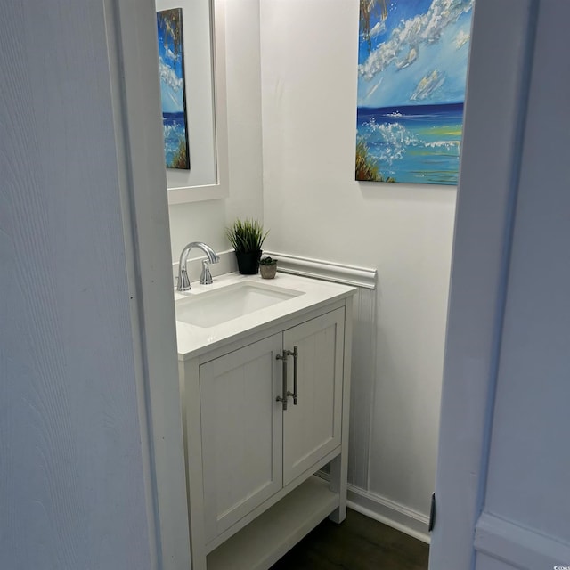 bathroom with vanity and baseboards