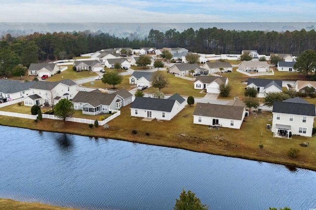 aerial view with a residential view and a water view