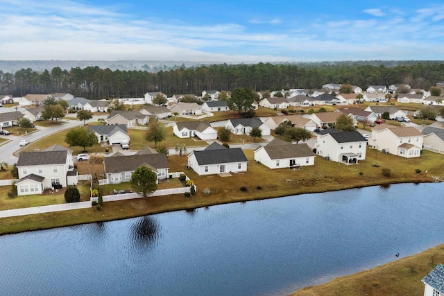 drone / aerial view with a residential view and a water view