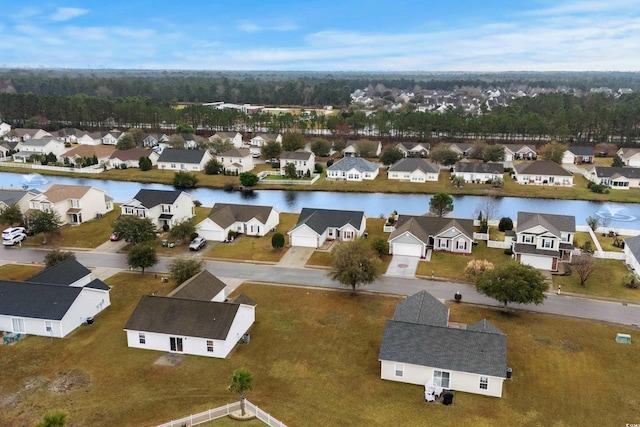 drone / aerial view featuring a residential view and a water view