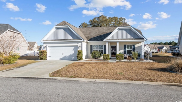 view of front of house with driveway, a porch, board and batten siding, a shingled roof, and a garage