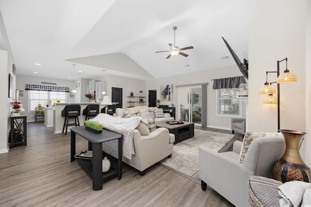 living room featuring light wood finished floors, recessed lighting, baseboards, and a ceiling fan