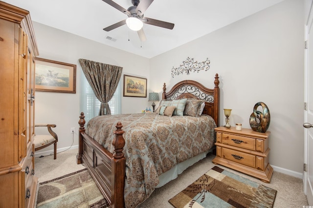 bedroom featuring visible vents, light carpet, baseboards, and a ceiling fan