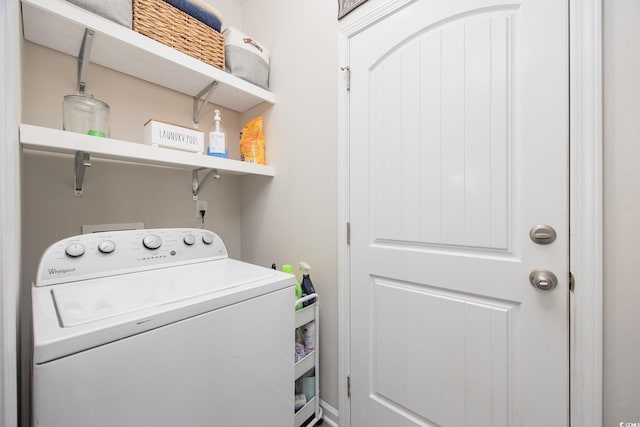 clothes washing area featuring laundry area and washer / dryer