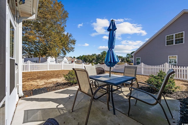 view of patio / terrace with outdoor dining area and a fenced backyard