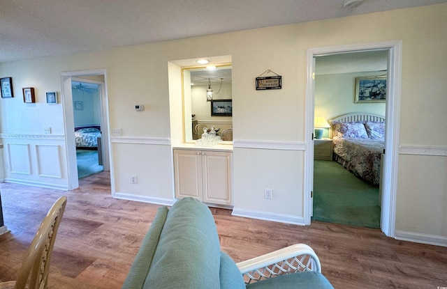 4430 Eastport Blvd Unit L9, Little River, SC 29566 - living area with wainscoting and light wood-type flooring