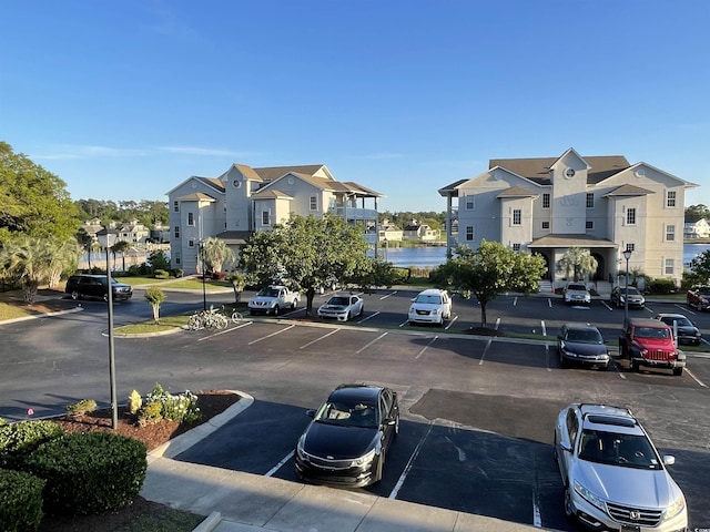 4430 Eastport Blvd Unit L9, Little River, SC 29566 - uncovered parking lot with a residential view