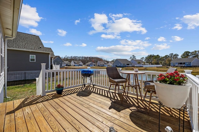 wooden deck featuring a residential view