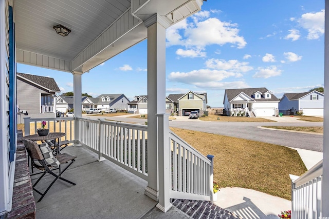 balcony with a residential view and a porch