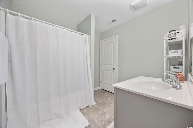 full bath with visible vents and vanity