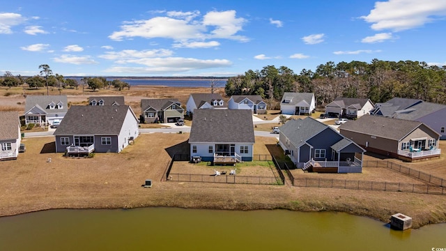 aerial view with a residential view and a water view