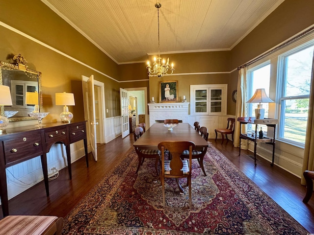 dining room featuring wooden ceiling, crown molding, an inviting chandelier, and wood finished floors