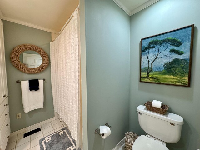 bathroom with a shower with curtain, toilet, ornamental molding, tile patterned flooring, and baseboards