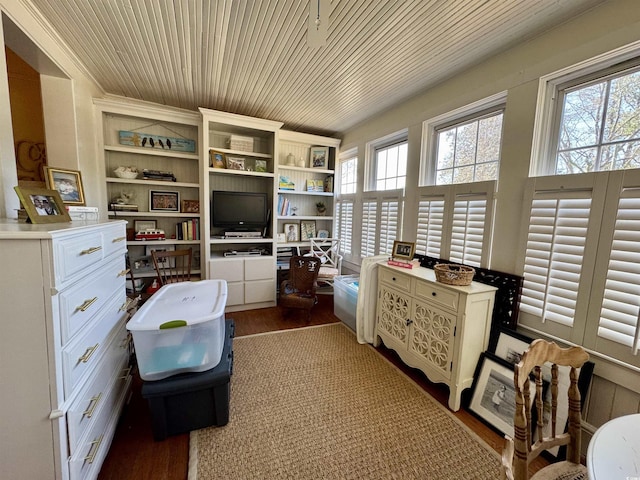 office area with wooden ceiling, built in shelves, and wood finished floors