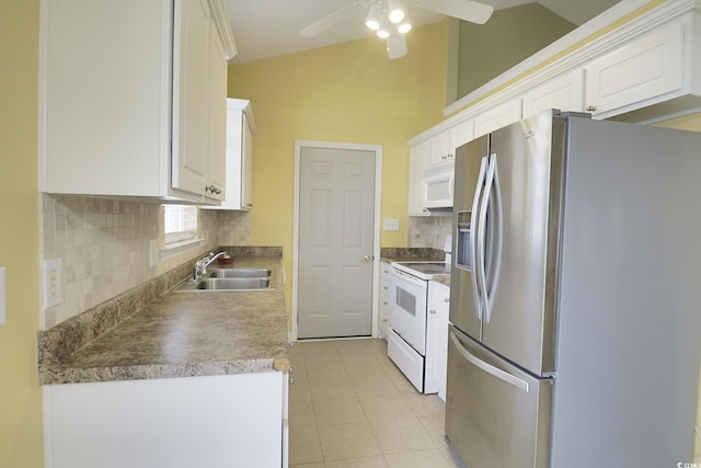 kitchen with white appliances, a sink, ceiling fan, white cabinetry, and tasteful backsplash