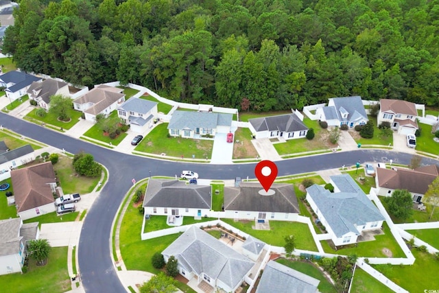 birds eye view of property with a residential view