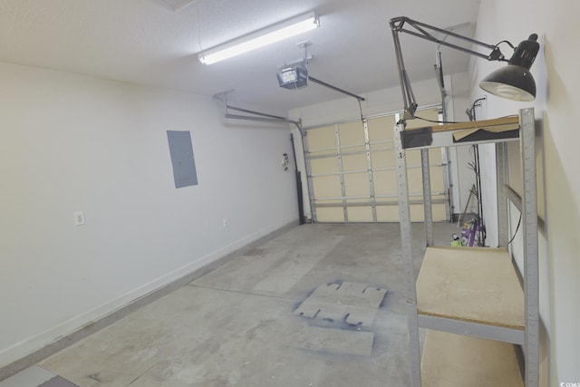 garage with electric panel, a garage door opener, and baseboards