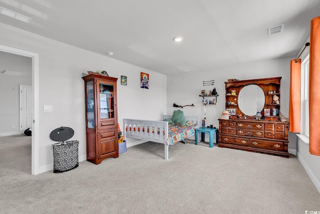 bedroom with carpet flooring, baseboards, and visible vents