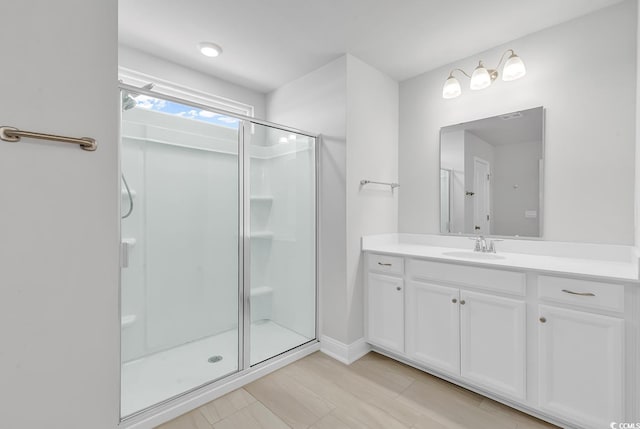 bathroom with vanity and a stall shower