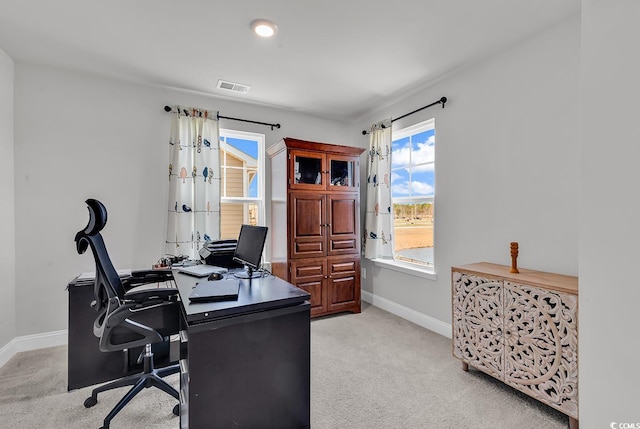 office with baseboards, visible vents, and carpet floors