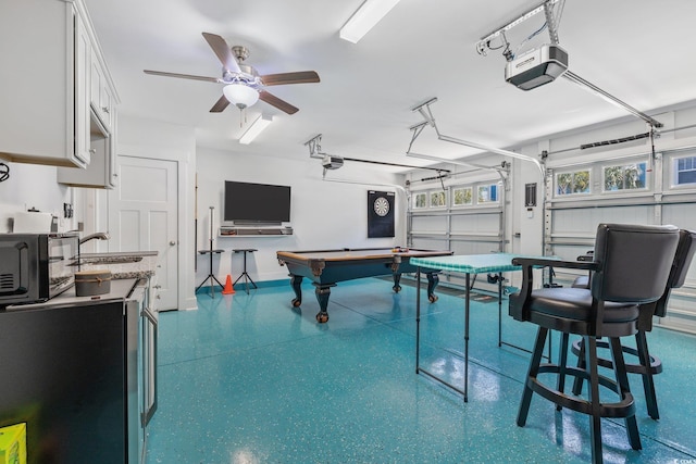 2406 Seabreeze Pl, Myrtle Beach, SC 29577 - rec room featuring speckle patterned floor, a garage, and ceiling fan