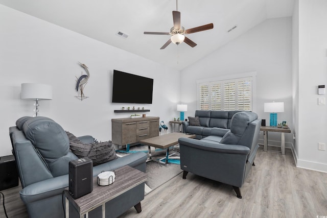 living room featuring a ceiling fan, visible vents, baseboards, high vaulted ceiling, and light wood-style floors