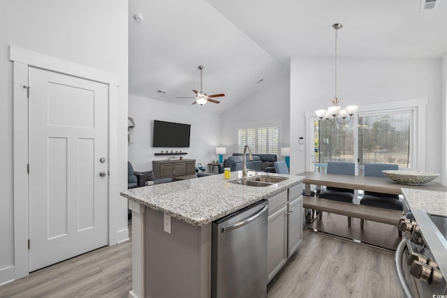 2406 Seabreeze Pl, Myrtle Beach, SC 29577 - kitchen with appliances with stainless steel finishes, light wood-type flooring, a chandelier, a ceiling fan, and light stone counters