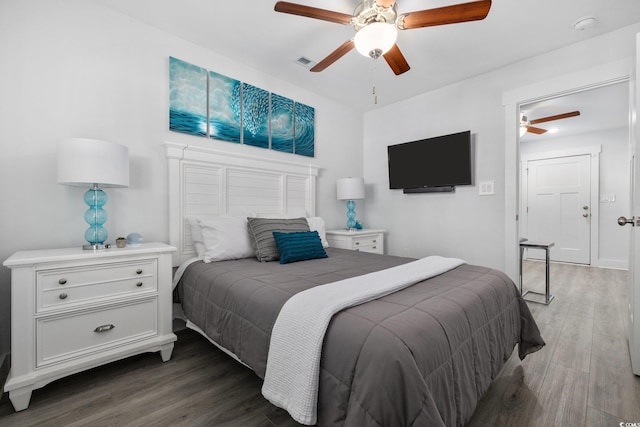2406 Seabreeze Pl, Myrtle Beach, SC 29577 - bedroom with wood finished floors and ceiling fan