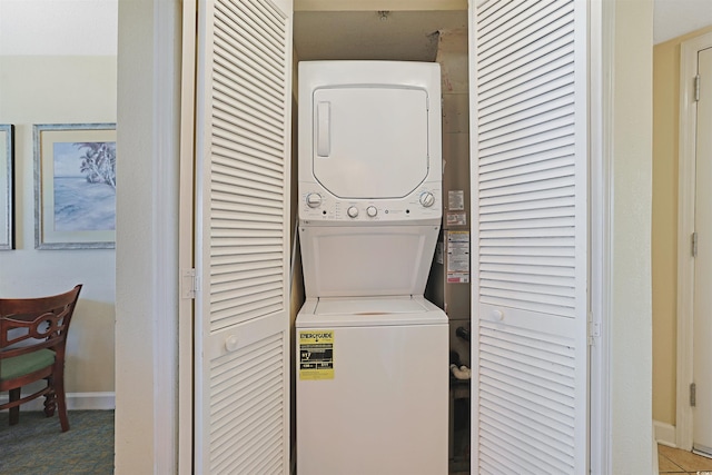 2501 S Ocean Blvd Unit 201, Myrtle Beach, SC 29577 - laundry area featuring estacked washer and dryer and baseboards