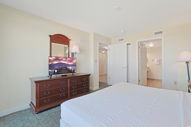 2501 S Ocean Blvd Unit 201, Myrtle Beach, SC 29577 - bedroom featuring connected bathroom and baseboards
