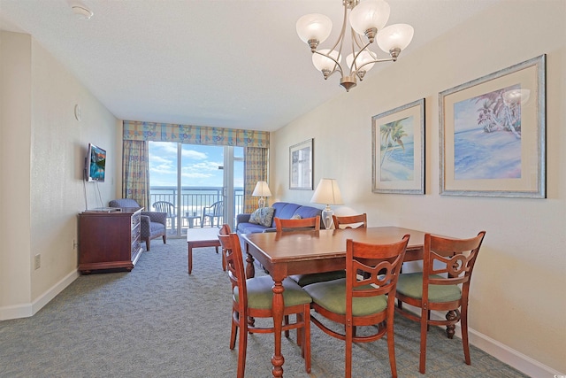 2501 S Ocean Blvd Unit 201, Myrtle Beach, SC 29577 - dining room with a chandelier, baseboards, and carpet floors