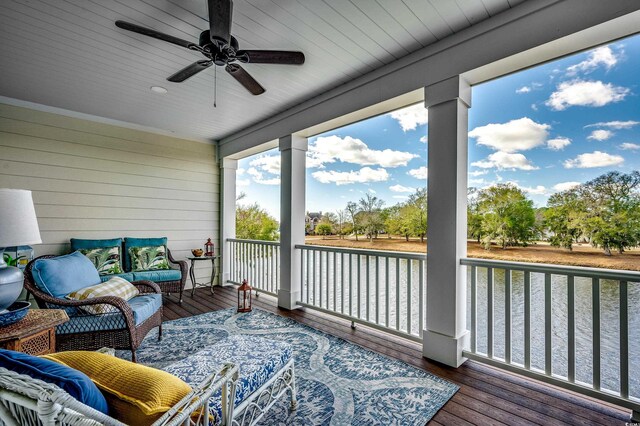 sunroom / solarium featuring ceiling fan